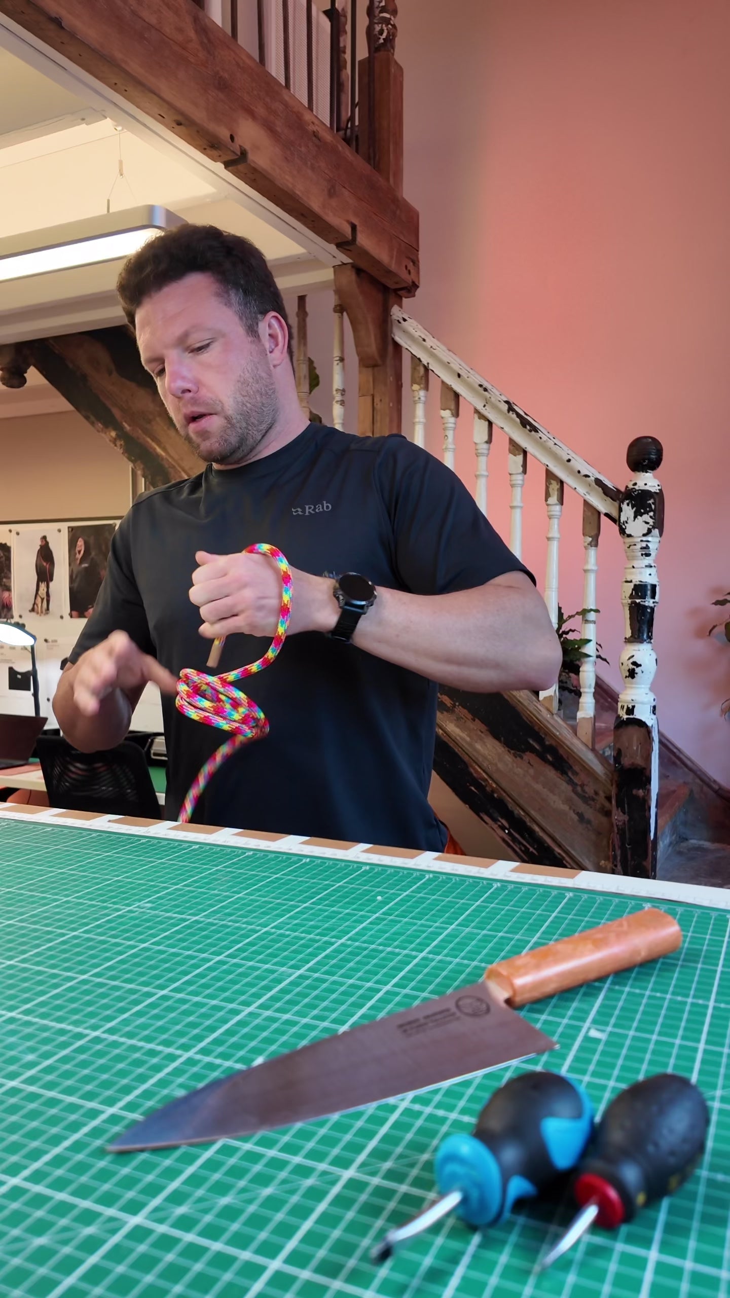 Ben from Re:Made hand-tying a rainbow Tendon® climbing rope handsfree dog lead in the UK workshop
